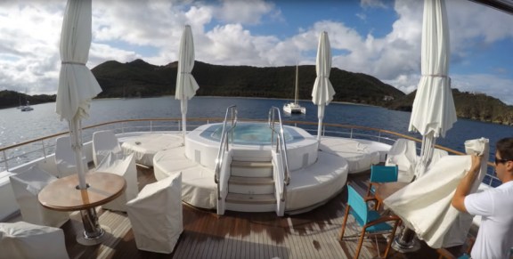 Sundeck jacuzzi on a motor yacht anchored in a Caribbean bay